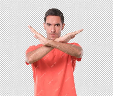 Premium PSD | Serious young man with a gesture of prohibition