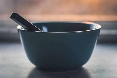 Download Ceramic Bowl With Spoon Wallpaper | Wallpapers.com