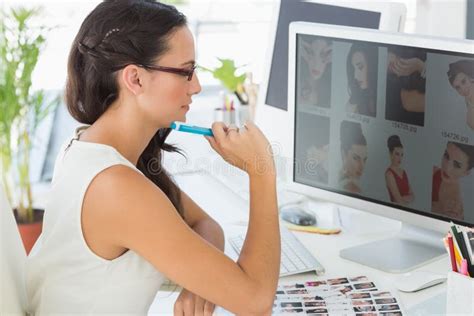 Focused Young Editor Working at Her Desk Stock Photo - Image of company, caucasian: 39192934
