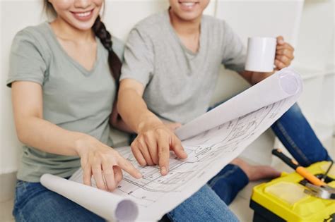 Premium Photo | Couple discussing house plan