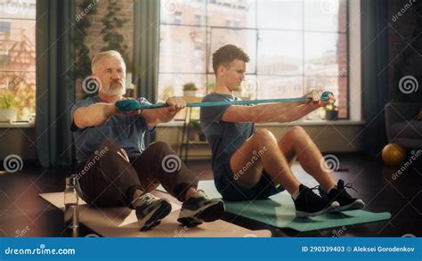 Middle Aged Man Exercising at Home with Personal Trainer. Senior Male Strengthening Core Muscles ...