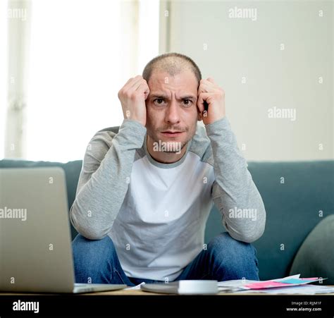 Desperate entrepreneur young man managing finances, reviewing bank ...