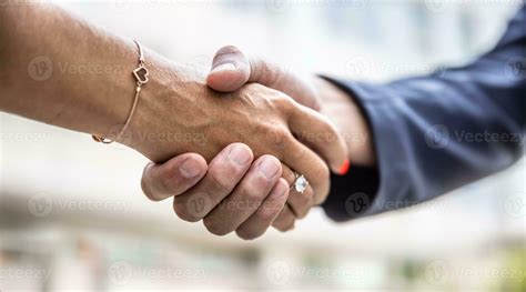 Detail of a professional handshake of a male and female hand 27490607 Stock Photo at Vecteezy