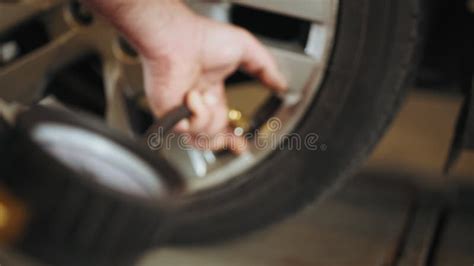 Car Tire Pressure Check in the Auto Service Garage. Detail of Inflating ...
