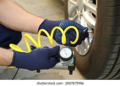 Mechanic Checking Air Pressure Car Tire Stock Photo 2007879986 ...