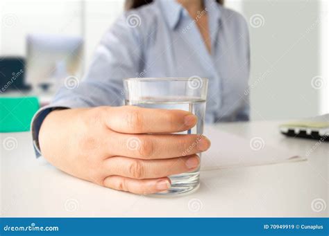 Businesswoman Drinking Water at Office Stock Image - Image of business, glass: 70949919
