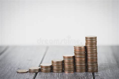 Coin Stack Step Up Growing Growth Saving Money on Wooden Table and White Background. Saving ...