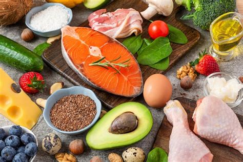 Premium Photo | Healthy balanced diet food keto low carb atkins diet concept fish meat fruits ...