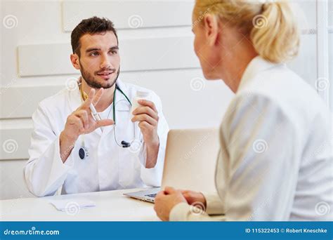 Doctor in consultation stock image. Image of patient - 115322453