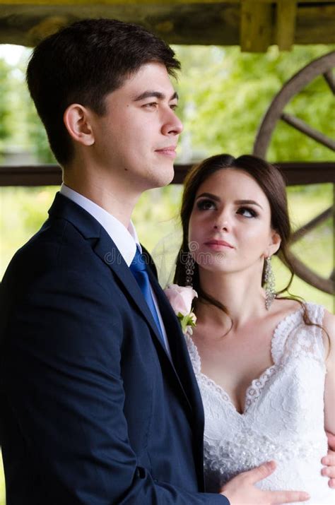 A Beautiful Married Couple in Wedding Dresses, Posing for a Photo ...