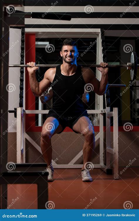 Young Men Doing Barbell Squats Stock Image - Image of exercising ...