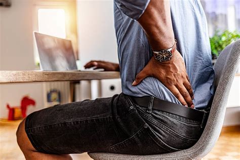 How can desk-bound men improve posture & prevent back pain?
