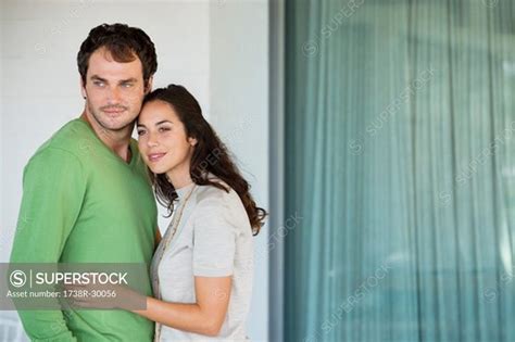 Couple smiling together - SuperStock