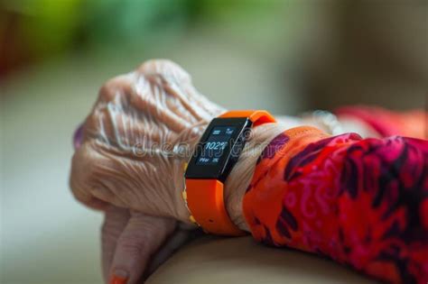 Close-up of a Smartwatch on a Wrist Displaying Heart Rate Data ...