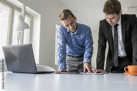 Two male business partners having a discussion Stock Photo | Adobe Stock