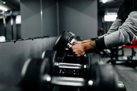 Premium Photo | A man lifting weights in a gym