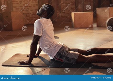 Body Stretch. Fit Man Stretching Back, Doing Yoga Workout at Gym Stock Photo - Image of back ...