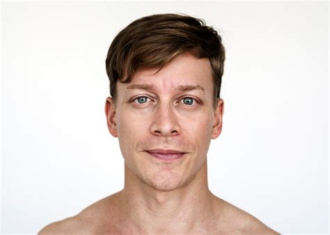 At what average age does the laryngeal prominence, commonly known as the Adam’s apple, typically become noticeable in males?
