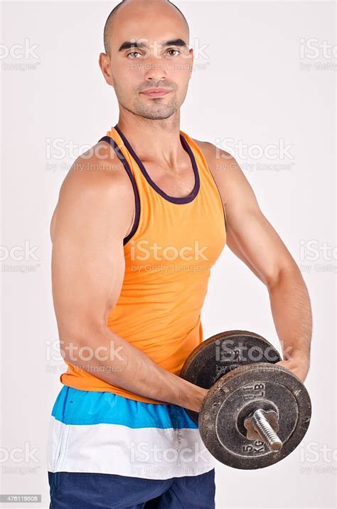 Strong Man Lifting Weights Stock Photo - Download Image Now - 2015 ...