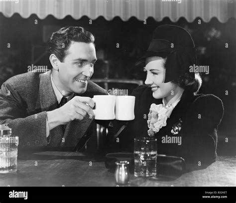 Couple people drinking hot beverages hi-res stock photography and ...