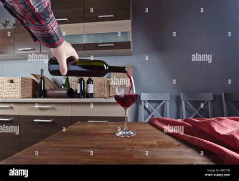Man pouring red wine wineglass hi-res stock photography and images - Alamy