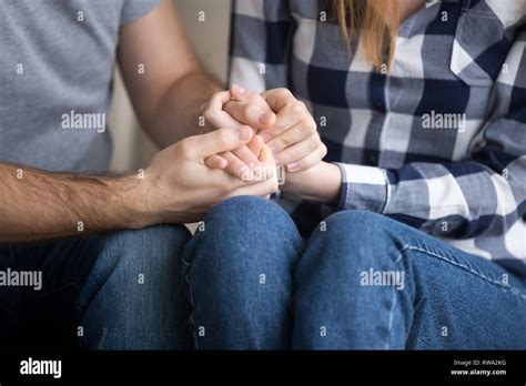 Married couple holding hands giving psychological support, close up view Stock Photo - Alamy