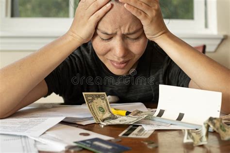 Woman Looking at Her Financial Bills Stressed Out; No Money/bankruptcy ...