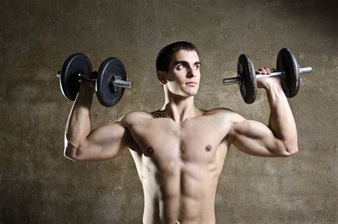 Young man lifting weights stock image. Image of lifestyle - 46714713