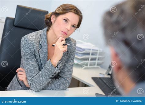 Businesswoman Listening Attentively To Male Client Stock Image - Image ...