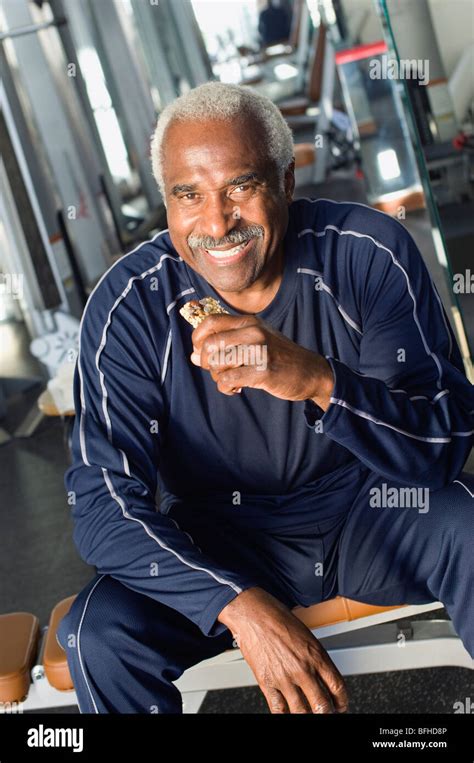 Senior Man Eating Healthy Snack at Gym Stock Photo - Alamy