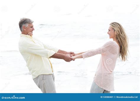 Happy Couple Holding Hands and Smiling at Each Other Stock Image ...