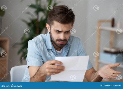 Confused Male Reading Letter Shocked by News Stock Photo - Image of document, letter: 132435638