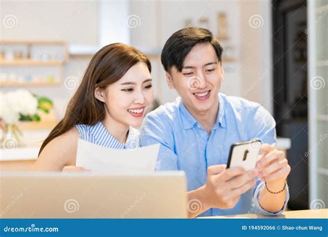 Couple Discuss Finances at Home Stock Photo - Image of family, home ...