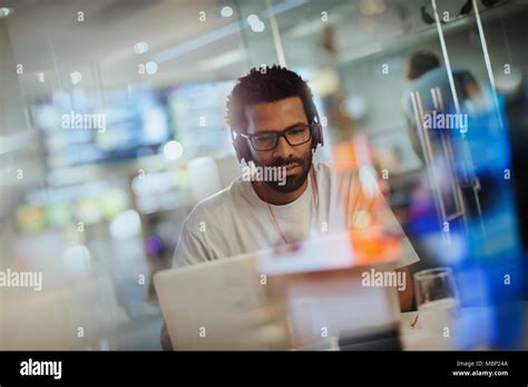 Office headphones hi-res stock photography and images - Alamy