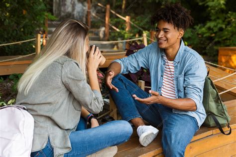 Premium Photo | Happy young multiethninc couple talking