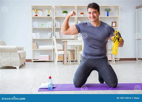 Young Man Exercising at Home in Sports and Healthy Lifestyle Con Stock ...