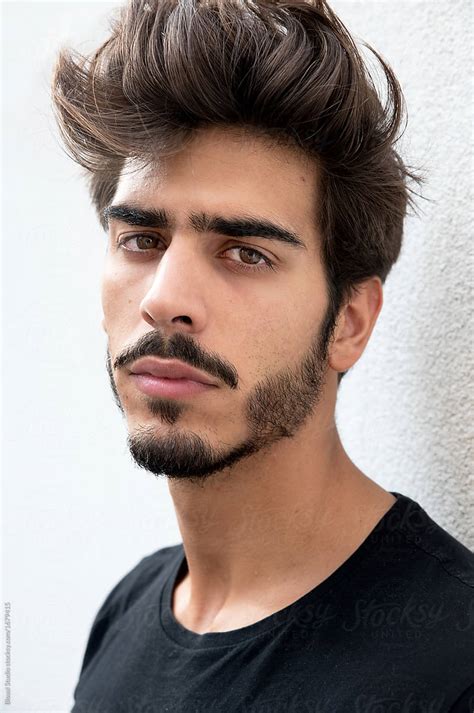 «Portrait Of A Handsome Young Man With Goatee Looking At Camera» del ...