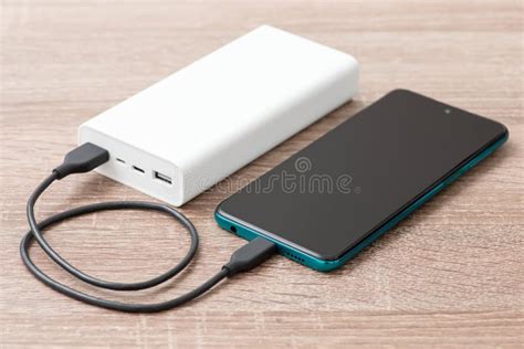 Modern Smart Phone Charging with Help of Big Power Bank Stock Photo ...