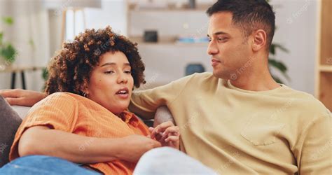 Premium Photo | Trust empathy and a couple talking on a sofa in the living room of their home ...
