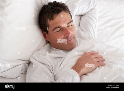 Man Sleeping Peacefully In Bed Stock Photo - Alamy
