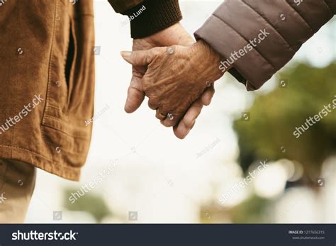 Elderly Couple Holding Hands