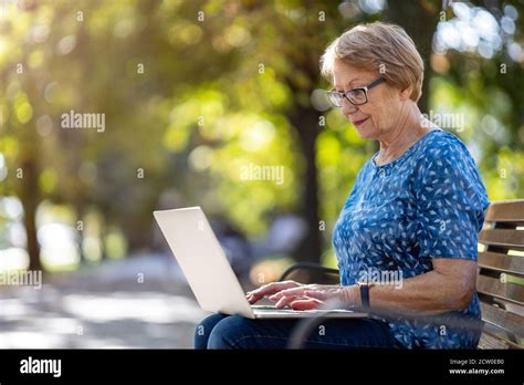 Mature grandmother using laptop hi-res stock photography and images - Alamy