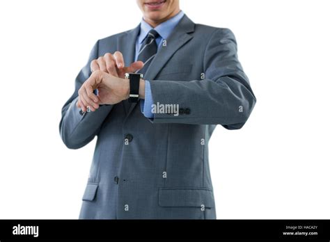 Businessman checking his smart watch Stock Photo - Alamy
