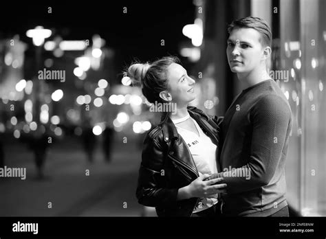 Beautiful couple on a date in a night city outdoor Stock Photo - Alamy