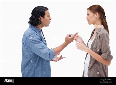 Side view of couple having a serious conversation Stock Photo - Alamy
