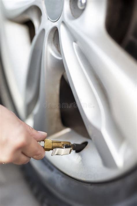 Woman Checking Car Tire Pressure Stock Photo - Image of auto, safety ...