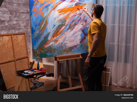 Someone Painting On Canvas