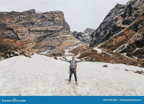 Man with Backpack Trekking in Mountains. Cold Weather, Snow on Hills. Winter Hiking Stock Photo ...
