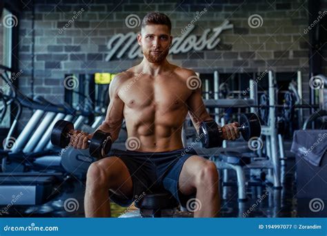 Close Up of a Muscular Young Man Lifting Weights in Gym Editorial ...