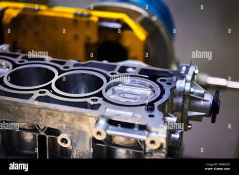Engine cylinder block with installed pistons in workshop Stock Photo ...